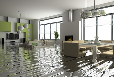 A living room flooded with water from the floor.
