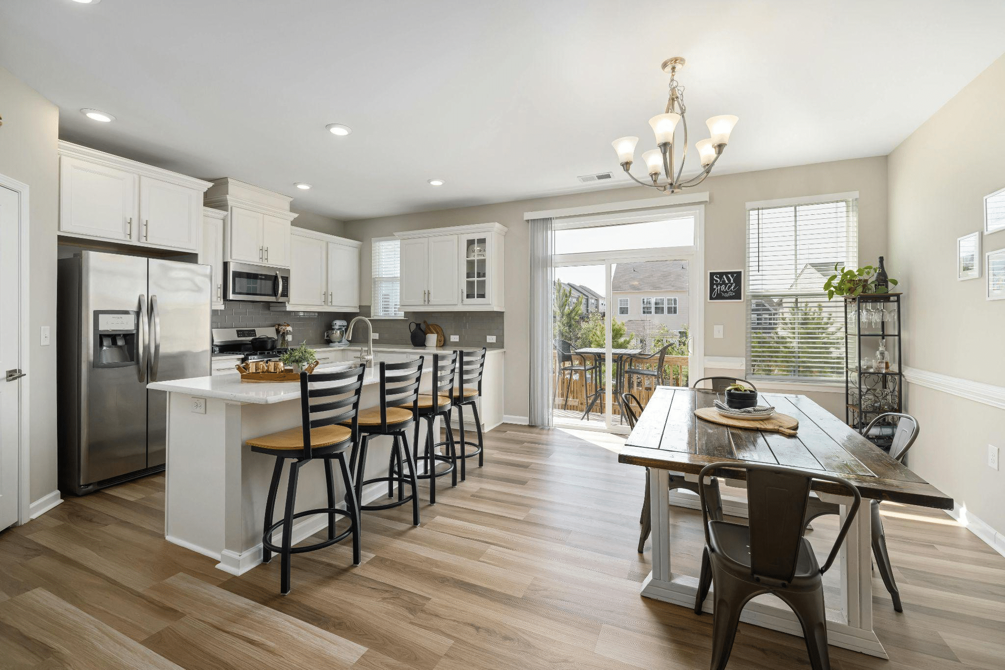 Bright modern kitchen and dining area with LVP floors